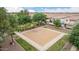 A well-maintained community basketball court surrounded by trees and green space, perfect for friendly games and exercise at 1162 S Agnes Ln, Gilbert, AZ 85296