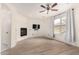 Bedroom featuring an electric fireplace, ceiling fan, and hardwood floors at 1162 S Agnes Ln, Gilbert, AZ 85296