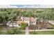 A beautiful community center with a gated entrance, lush landscaping, and a view of the pool area beyond at 1162 S Agnes Ln, Gilbert, AZ 85296