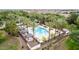 Inviting community pool with palm trees, lounge chairs, and shaded cabanas for relaxation and enjoyment at 1162 S Agnes Ln, Gilbert, AZ 85296
