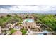 Aerial view of a luxurious community pool area surrounded by well-manicured landscaping and cozy seating at 1162 S Agnes Ln, Gilbert, AZ 85296