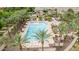 Large community pool surrounded by palm trees and lounge chairs, providing a resort-like atmosphere at 1162 S Agnes Ln, Gilbert, AZ 85296