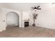 Bright living room with a fireplace, hardwood floors, and plenty of natural light at 1162 S Agnes Ln, Gilbert, AZ 85296