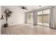 Living room featuring a ceiling fan, hardwood floors, and sliding glass doors at 1162 S Agnes Ln, Gilbert, AZ 85296