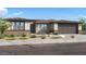 Charming single-story home features desert landscaping, neutral color palette and large windows at 1245 W Via Las Brisas Ln, San Tan Valley, AZ 85140