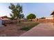 Spacious backyard with block fencing and a concrete patio at 126 E Mclellan Rd, Mesa, AZ 85201