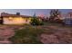 Expansive backyard view with a mix of grass and dirt, featuring a mature tree and the home's exterior at 126 E Mclellan Rd, Mesa, AZ 85201