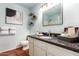 Stylish bathroom with granite vanity top, updated fixtures, and tiled floor at 126 E Mclellan Rd, Mesa, AZ 85201
