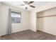 Simple bedroom with window, closet, and plush carpet creates a comfortable and versatile space for relaxation and rest at 126 E Mclellan Rd, Mesa, AZ 85201