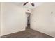 Cozy bedroom featuring neutral carpet and a ceiling fan for added comfort at 126 E Mclellan Rd, Mesa, AZ 85201