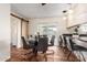 Charming dining area with a glass table, stylish chairs, and bar seating, perfect for entertaining at 126 E Mclellan Rd, Mesa, AZ 85201