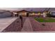 Inviting single-story home featuring solar panels, brick accents and a well-manicured, low maintenance front yard at 126 E Mclellan Rd, Mesa, AZ 85201