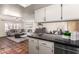 An open-concept kitchen with granite countertops seamlessly connects to the living room, perfect for entertaining and Gathering time at 126 E Mclellan Rd, Mesa, AZ 85201