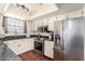 Bright kitchen featuring stainless steel appliances, granite countertops, and modern lighting for a delightful cooking experience at 126 E Mclellan Rd, Mesa, AZ 85201