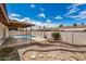 Large backyard featuring a pool, covered patio, gravel landscaping, and ample space to relax at 1332 E Redfield Rd, Tempe, AZ 85283