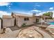 Picture of backyard with a pool, rock landscaping, covered patio, and storage shed at 1332 E Redfield Rd, Tempe, AZ 85283