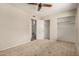 Bedroom features a ceiling fan, closet, and ensuite access at 1332 E Redfield Rd, Tempe, AZ 85283