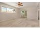 Bedroom featuring a ceiling fan and large window at 1332 E Redfield Rd, Tempe, AZ 85283