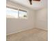 Bedroom with ceiling fan and large window at 1332 E Redfield Rd, Tempe, AZ 85283