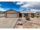 Charming single-story home featuring desert landscaping, a two-car garage, and a welcoming front entrance at 1332 E Redfield Rd, Tempe, AZ 85283