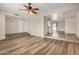 Spacious living room with multi-level flooring featuring laminate floors and an airy, open layout at 1332 E Redfield Rd, Tempe, AZ 85283