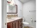Bathroom featuring a modern vanity, tiled floors, and shower over tub combo at 13424 N Emberwood Dr, Sun City, AZ 85351