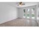 Bedroom featuring tile flooring, ceiling fan, and bright natural light at 13424 N Emberwood Dr, Sun City, AZ 85351