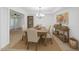 Bright dining room featuring seating for six and stylish décor and ample natural light at 13424 N Emberwood Dr, Sun City, AZ 85351