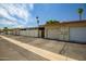 A row of single story homes with desert landscaping, attached garages, and pale color scheme at 13424 N Emberwood Dr, Sun City, AZ 85351