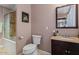 Bathroom featuring a toilet, vanity, mirror, and a shower-tub combination at 13608 N 33Rd Ave, Phoenix, AZ 85029