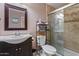 Bathroom with a sink, mirror, toilet, and tiled shower at 13608 N 33Rd Ave, Phoenix, AZ 85029