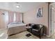 Bedroom with furniture, including chairs, table, and a bed at 13608 N 33Rd Ave, Phoenix, AZ 85029