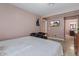 Bedroom with chairs, TV, and a dresser with a mirror at 13608 N 33Rd Ave, Phoenix, AZ 85029