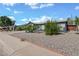 Charming single-story home featuring a gray exterior, well-maintained landscaping, and a two-car garage at 13608 N 33Rd Ave, Phoenix, AZ 85029