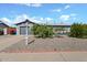 Charming single-story home featuring a gray exterior, well-maintained landscaping, and a two-car garage at 13608 N 33Rd Ave, Phoenix, AZ 85029
