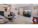 Comfortable living room featuring tiled floors and a wall-mounted TV at 13608 N 33Rd Ave, Phoenix, AZ 85029