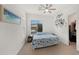 Bedroom filled with bright natural light and calming coastal themed accents at 14587 W Alexandria Way, Surprise, AZ 85379