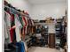 Walk-in closet providing ample storage space with shelves, rods, drawers, and organized personal items at 14587 W Alexandria Way, Surprise, AZ 85379