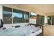 Luxurious hot tub on the patio with a mounted TV, offering a relaxing outdoor entertainment space at 14587 W Alexandria Way, Surprise, AZ 85379