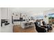 Spacious open kitchen and living area offering modern design and ample natural light at 14587 W Alexandria Way, Surprise, AZ 85379