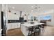 Stylish kitchen showcasing white cabinets, stainless appliances, and a large island at 14587 W Alexandria Way, Surprise, AZ 85379