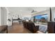 Cozy living room with wood floors, stylish furnishings, and seamless access to the outdoor swimming pool at 14587 W Alexandria Way, Surprise, AZ 85379