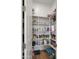 Organized pantry with white shelving provides ample storage space for food and household items at 14587 W Alexandria Way, Surprise, AZ 85379