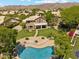 Aerial view of home's spacious backyard, featuring a pool, lush landscaping, and a balcony overlooking the yard at 14655 S 25Th Way, Phoenix, AZ 85048