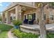 Charming backyard area with cozy seating, lush landscaping, and a covered patio perfect for outdoor enjoyment at 14655 S 25Th Way, Phoenix, AZ 85048