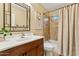 Clean bathroom with a shower and tub combination and a modern vanity at 14655 S 25Th Way, Phoenix, AZ 85048