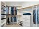 Walk-in closet with well-organized storage solutions, including shelving and hanging racks at 14655 S 25Th Way, Phoenix, AZ 85048