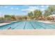 Large community pool with lap lanes and lounge chairs, providing a relaxing space for residents at 14655 S 25Th Way, Phoenix, AZ 85048