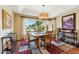 Lovely dining room featuring a chandelier and large windows with backyard views at 14655 S 25Th Way, Phoenix, AZ 85048