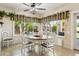 Inviting dining room featuring a chandelier, neutral color scheme, and views of backyard at 14655 S 25Th Way, Phoenix, AZ 85048